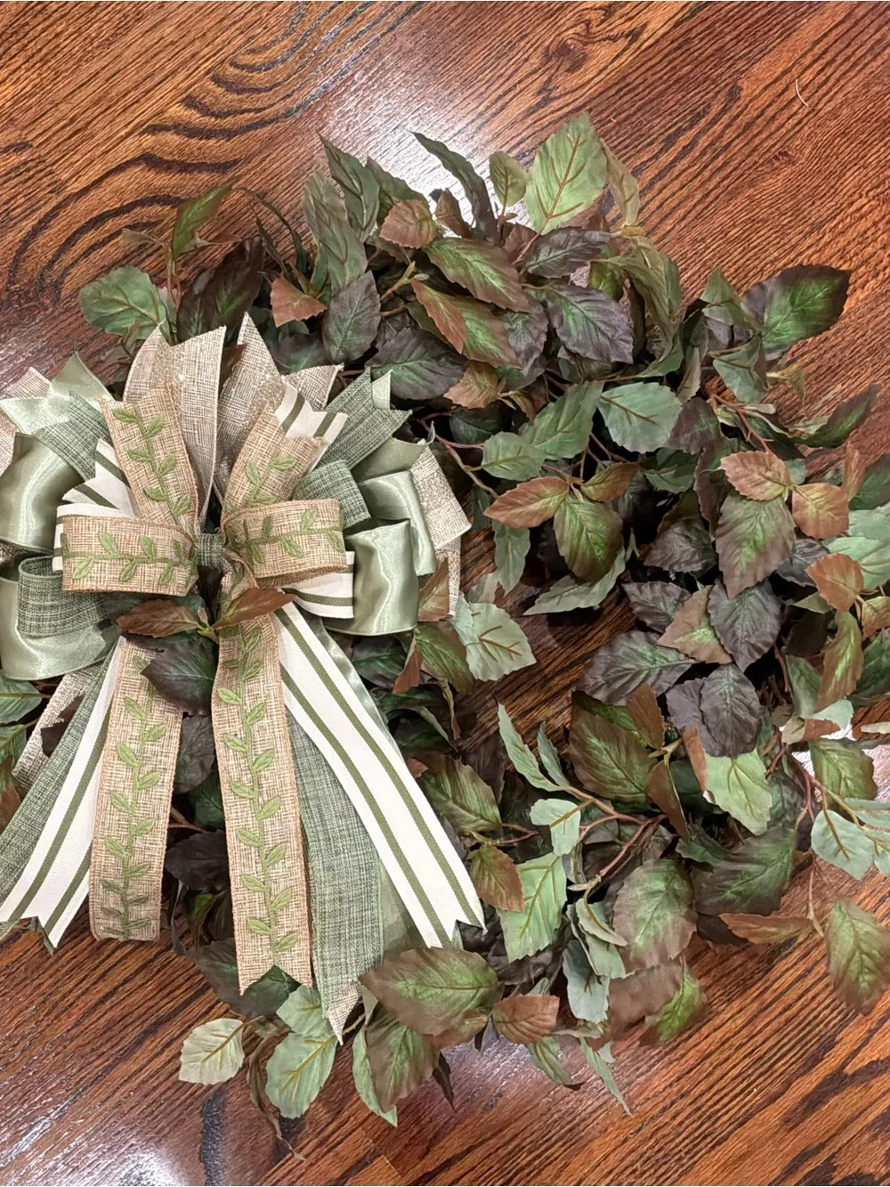 Green Leaf Holiday Wreath with Decorative Striped Ribbon Bow